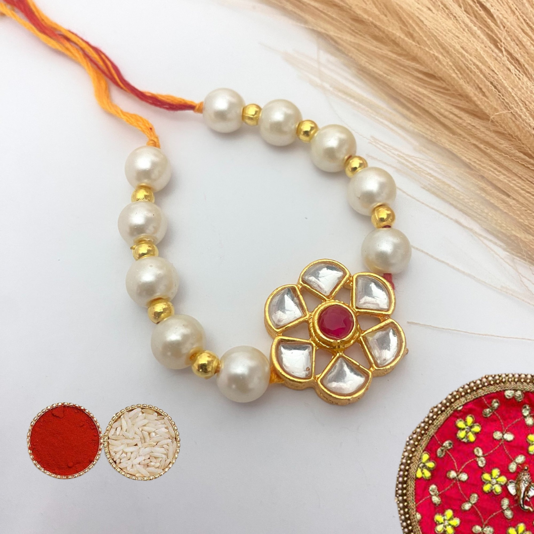 Traditional Pearl Thread Rakhi with Kundan Floral Design and Roli Chawal